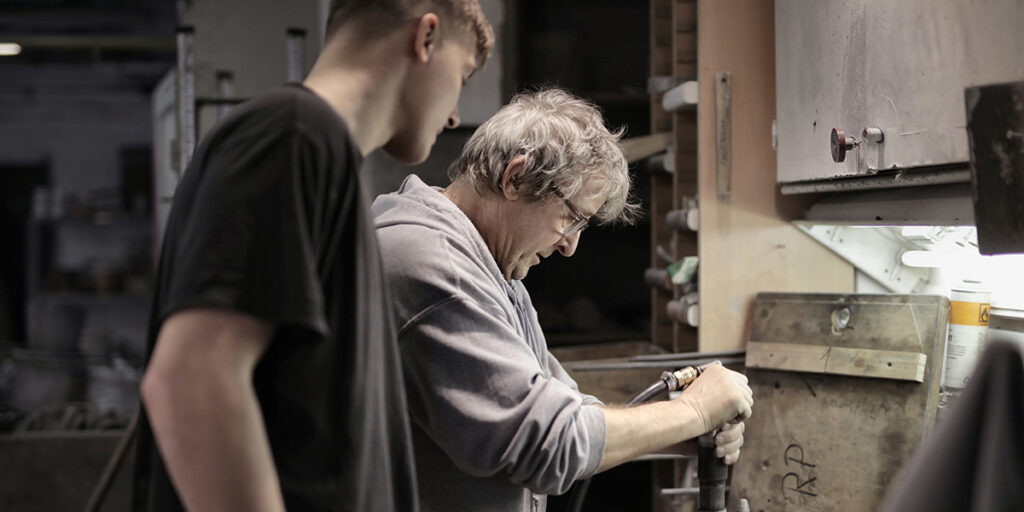 Level 3 Boatbuilder Apprentice working with mentor.