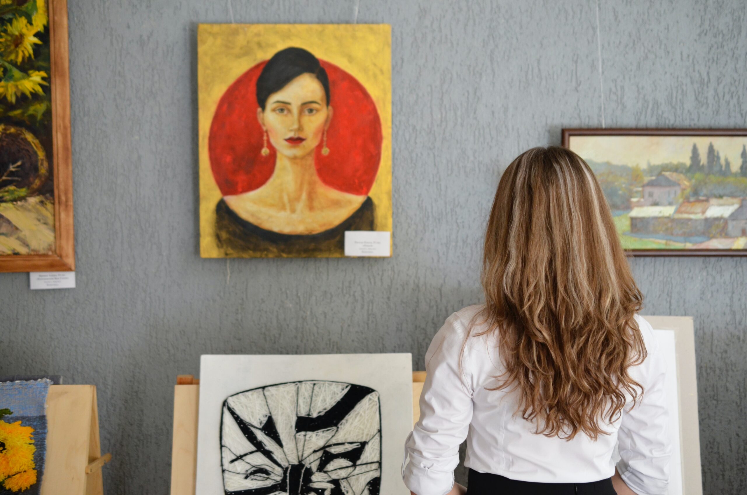 Woman in a gallery doing her Cultural Heritage Conversation Apprenticeship
