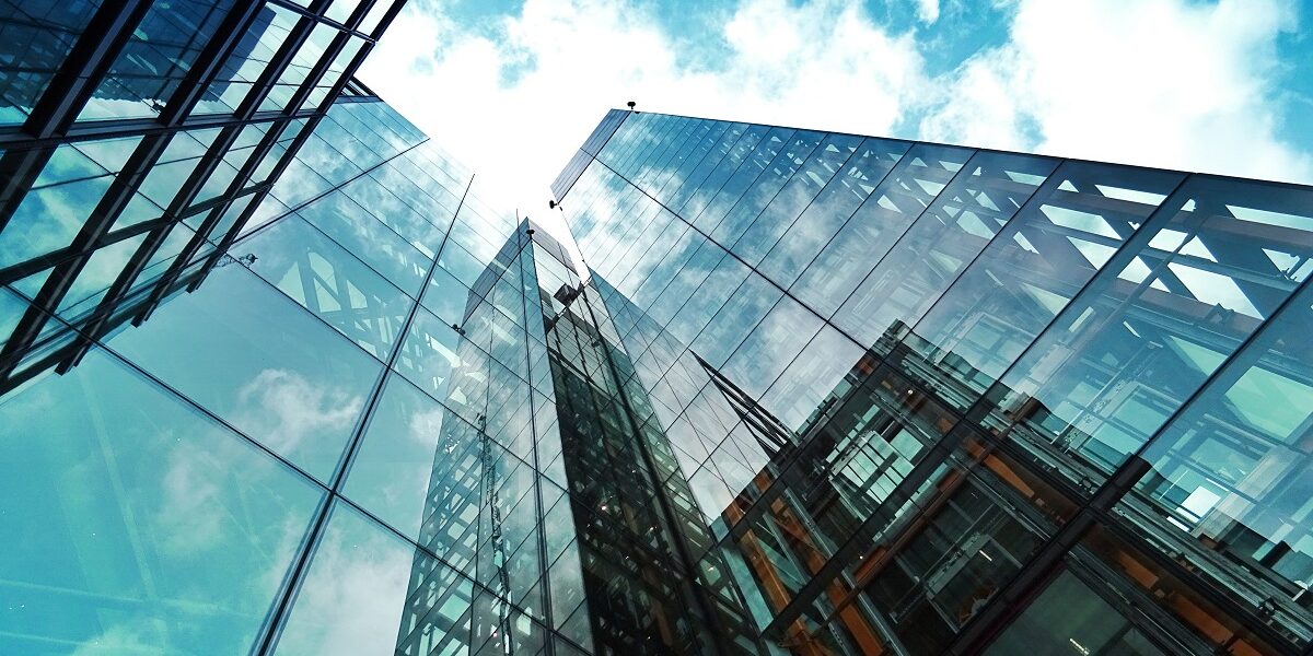 Worm’s eye view of contemporary, glass high-rise buildings
