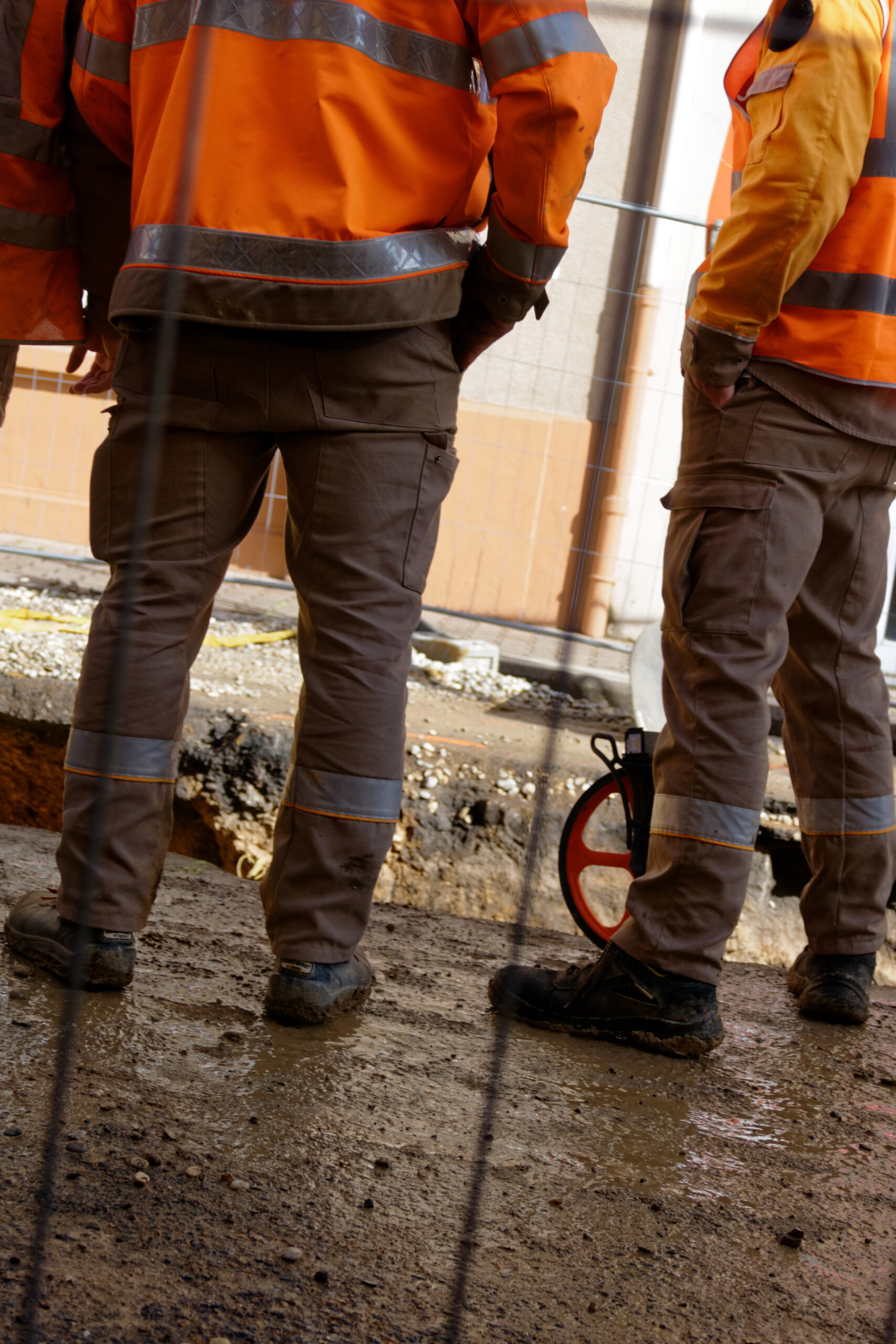 Colleagues communicating with one another on the job. Showing a skill gained through a fencing installer apprenticeship.