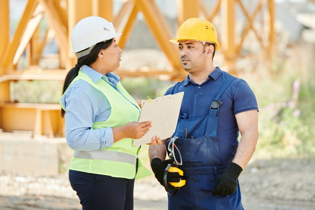 Man and Woman on Construction Site