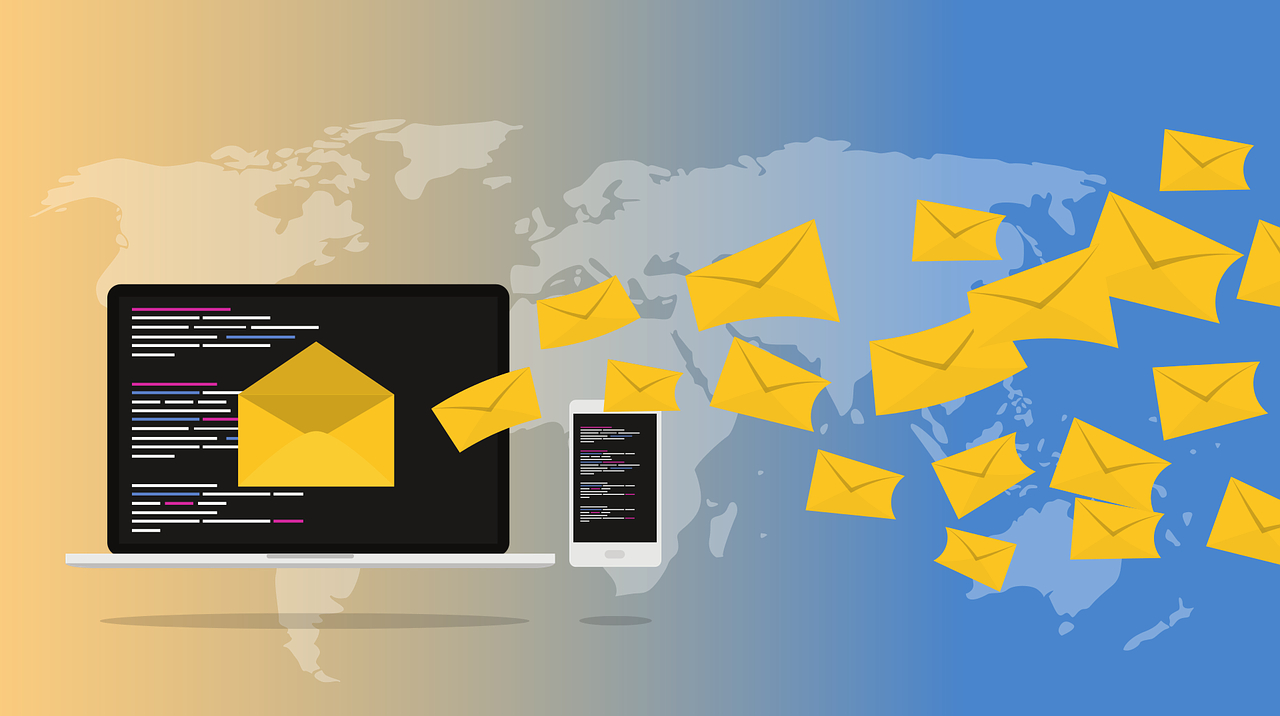 Envelopes fly out of a laptop into the air to demonstrate emails being sent