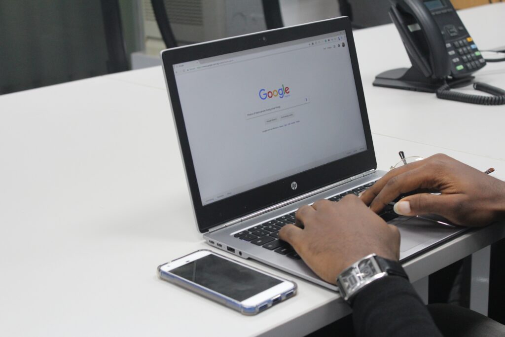 A laptop showcasing a Google search page, to be used as a header image on a keyword research article.