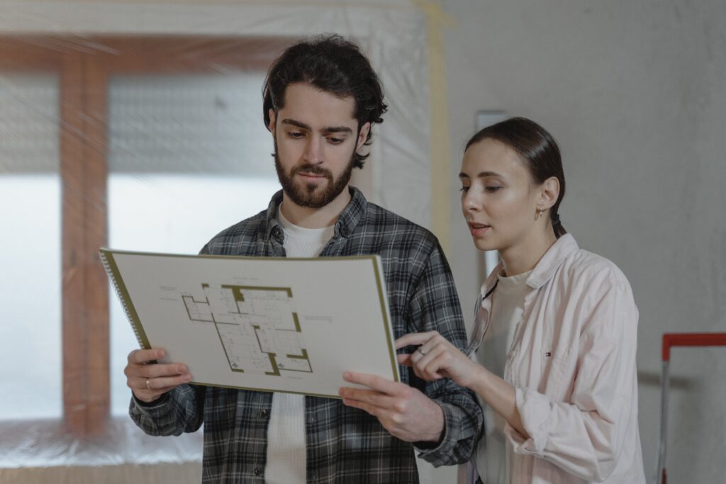 Building control surveyors analysing a building plan