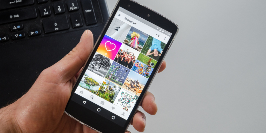 A person holding their phone open on Instagram