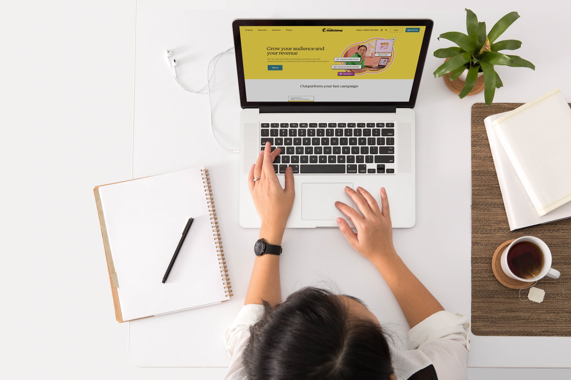 A person on a laptop looking at an email service provider