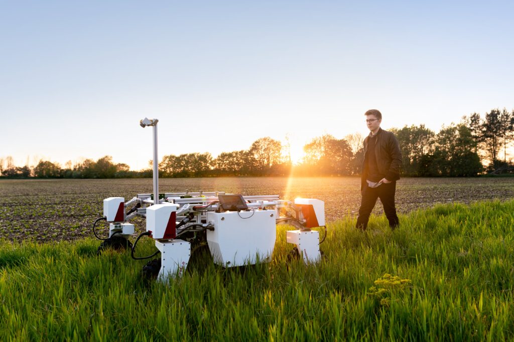 Agriculture or Horticulture apprentices learn in a data and scientific driven environment. image shows man with agricultural engineering machine in a field