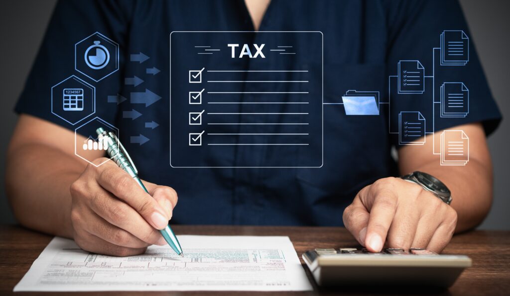 An image of hands working on payroll calculations.