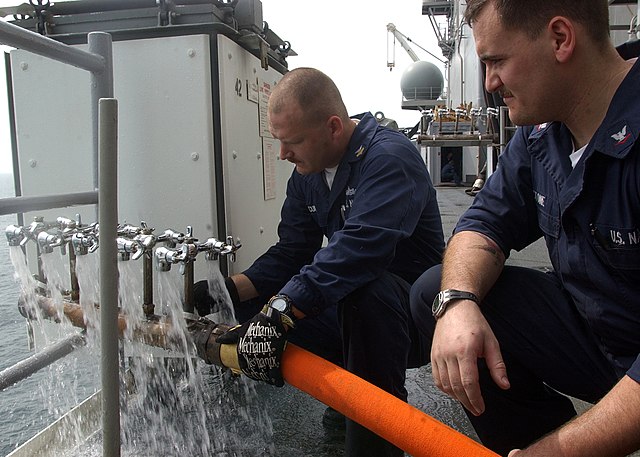 technicians test a fresh water distribution manifold