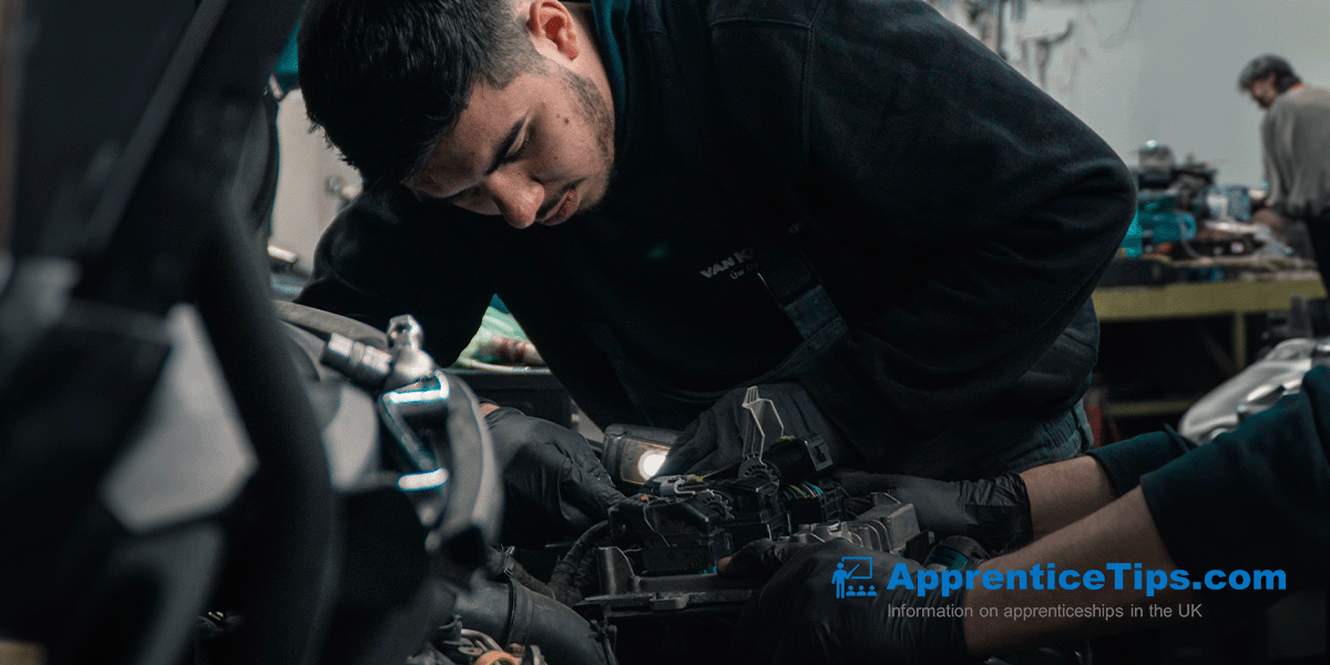 man fixing car engine