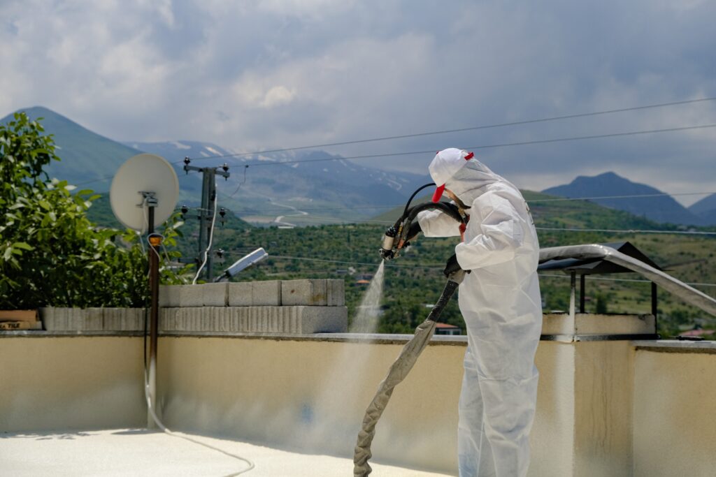 Thermal Insulation technician  apprentice working on a commercial building 