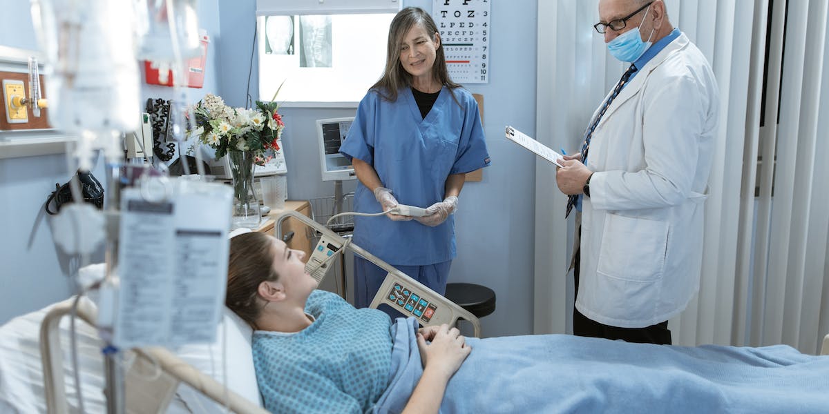 Nursing Associate with patient and doctor